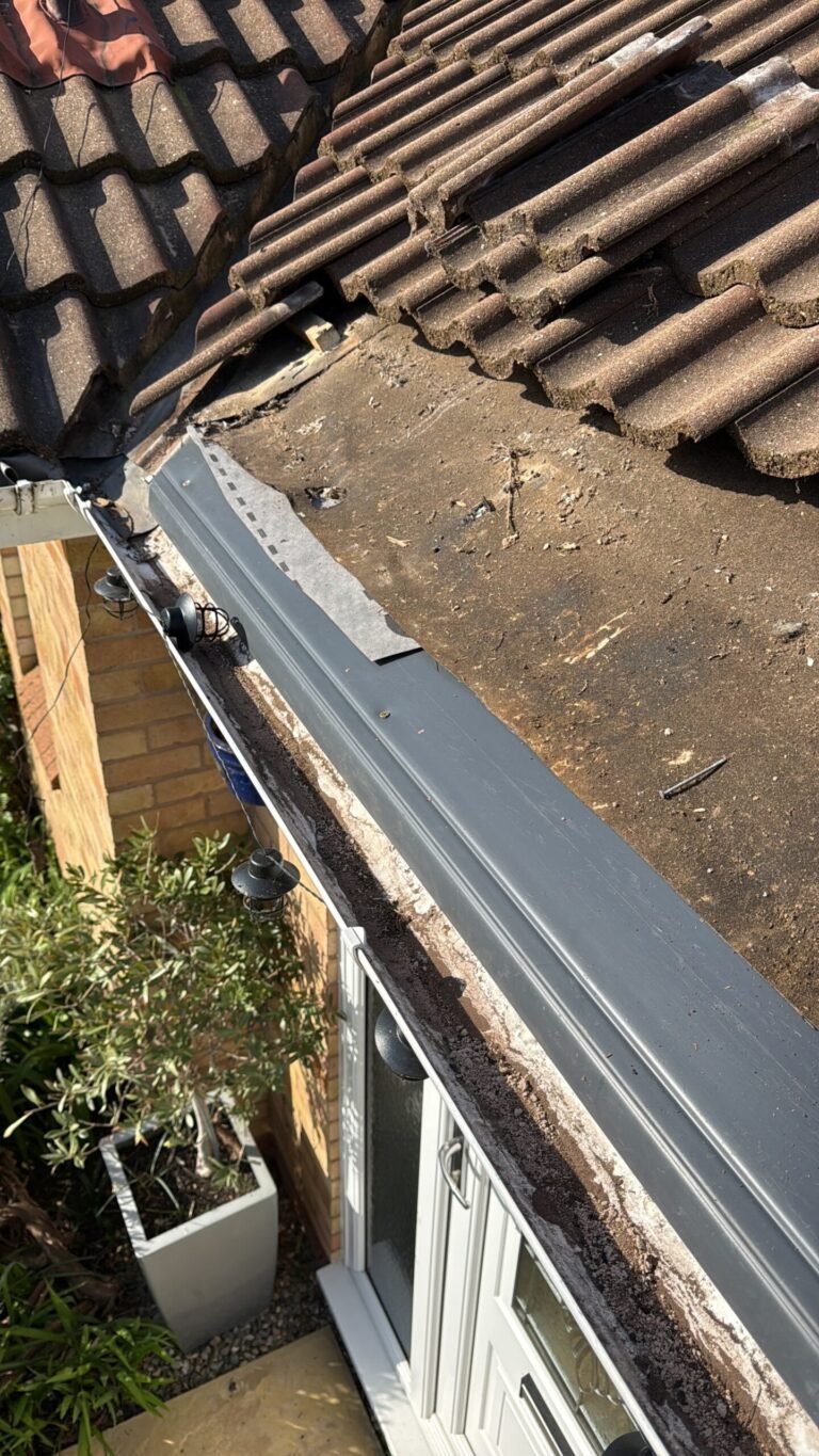 Roofline and guttering repairs beneath a tiled roof
