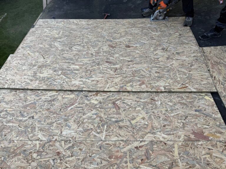 Roof decking prepared for a flat roofing system